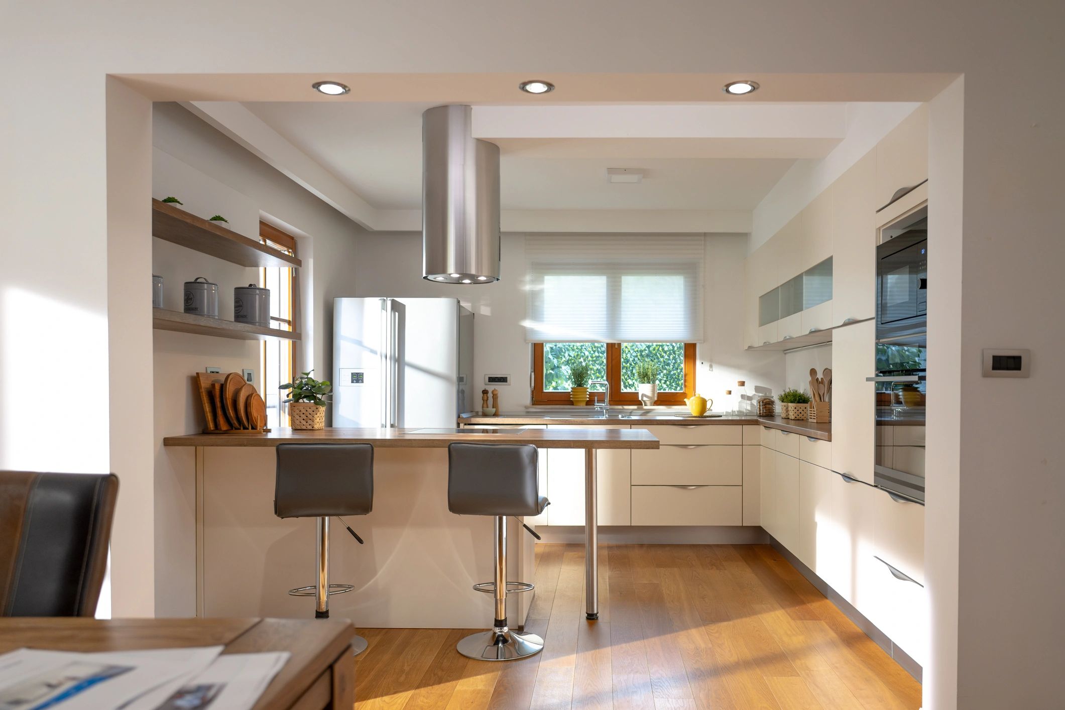 Sunlit modern kitchen with warm wood floors