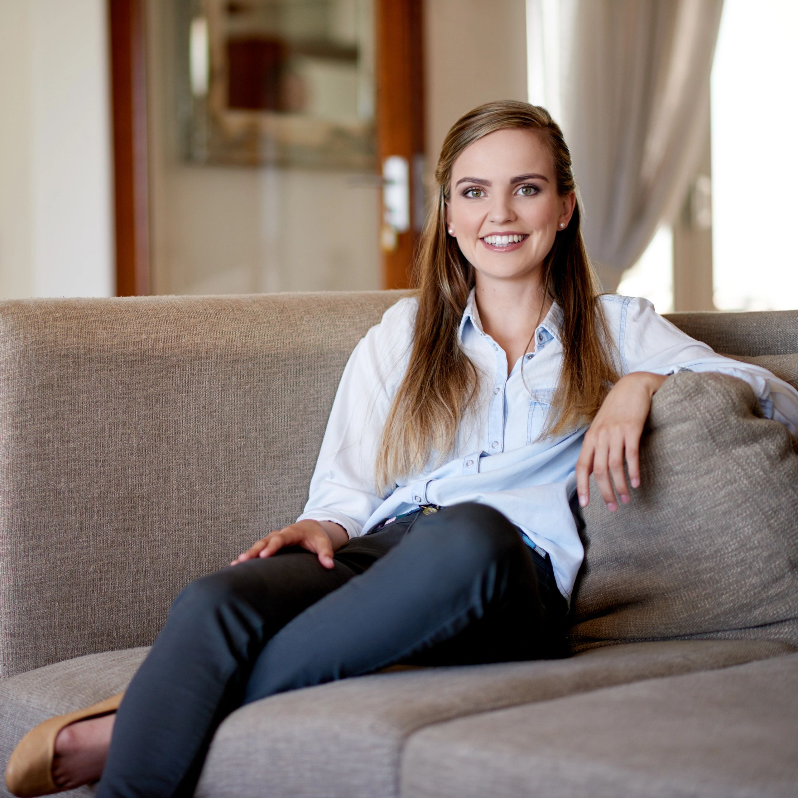 Portrait of a relaxed client on a sofa